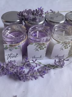 lavender candles and tags with thank you written on them