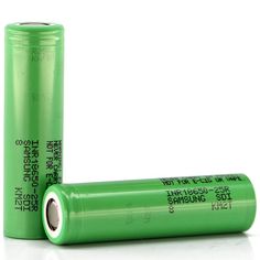 two green batteries sitting next to each other