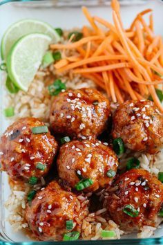 meatballs, carrots and rice in a glass container with green garnish