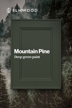 the mountain pine deep green paint is on display in front of a forest backdrop with trees