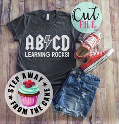 a t - shirt that says abcd learning rocks next to an image of a cupcake