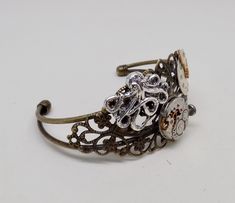 "Awesome steampunk cuff bracelet made of vintage watch and gears mounted on a brass Victorian filigree cuff. The cuff is 6 1/2\" . All my jewelry come in a nice gift box. More steampunk bracelets in my shop www.etsy.com/shop/slotzkin" Victorian Filigree, Steampunk Bracelet, Chris Johnson, Dichroic Glass Earrings, Kailua Kona, Steampunk Jewelry, Tiny Earrings, Glass Earrings, Cool Items