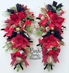 two christmas wreaths with red and black bows