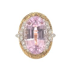 One pink kunzite and diamond 18K yellow gold and platinum ring featuring one oval brilliant cut kunzite weighing 25.50 ct. Enhanced by 14 round brilliant cut diamonds totaling 0.25 ct. and with a textured sponge gold finish. Circa 1960s. Vibrant, powerful, mesmerizing. Additional information: Metal: Platinum and 18K yellow gold Gemstone: Kunzite = 25.40 ct. Gemstone: Diamonds totaling 0.25 ct., H-I / VS-2 Circa: 1960s Stamp/Hallmark: 25.40, D0.25, PT900, K18 Size/Measurements: 8 ring size Weight: 20 grams Pink Kunzite, Platinum Ring, Gold Platinum, Round Brilliant Cut Diamond, Cocktail Rings, Round Brilliant, Gold Finish, 1960s, Platinum