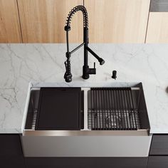 a stainless steel kitchen sink under a faucet