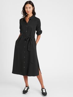 SUSTAINABLE: Made with luxuriously soft, lightweight and eco-friendly TENCEL™ lyocell, sourced from responsibly harvested wood.  SWING FIT: This flowy dress has been cut for a flattering, A-line fit.  No waist definition Point collar.  Button front.  Removable belt.  Side pockets.  Straight hem with 11" side slits.  Unlined.  Swing Fit: Fitted through the shoulders and arms, A-line through the chest, waist, and hips.  No waist definition.  Long sleeves.  Midi length.  Body length (Size 6): Petit Dress Shirts Women, Belted Shirt Dress, Black Midi, Shirts Women, Midi Shirt Dress, Dress Shapes, Banana Republic Dress, Spring Wardrobe, Black Shirt Dress