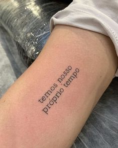 a woman's arm with the words temporary tattoos on her left forearm and an inscription written in cursive font