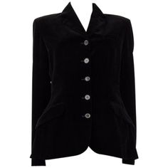 Hermes velvet blazer in black cotton (100%). With collar lining in dark taupe lambskun, notch collar, chest pocket, two flap pockets on the sides, slit on the back, and buttoned sleeves. Closes with urea buttons on the front. Lined in black silk (100%). Has been worn and is in excellent condition. Tag Size 42 Size L Shoulder Width 42cm (16.4in) Bust From 102cm (39.8in) Waist From 86cm (33.5in) Hips From 100cm (39in) Length 71cm (27.7in) Side Seam Length 46cm (17.9in) Sleeve Length 65cm (25.4in) Dark Taupe, Classic Blazer, Velvet Blazer, Notch Collar, Black Silk, Black Velvet, Black Cotton, Blazer Jacket, Velvet