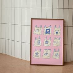 a pink frame with bags on it sitting next to a tiled wall in a bathroom