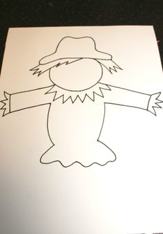 a drawing of a scarecrow on a piece of paper