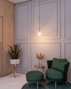 a green chair and ottoman in a room