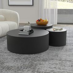 two round tables sitting on top of a rug in a living room