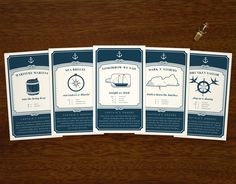 four cards with an anchor and ship wheel on them