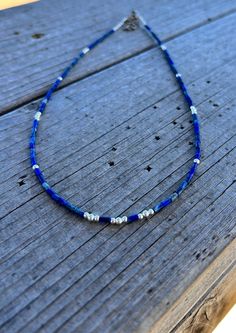 "This beautiful, petite necklace was made using 2 mm Lapis Lazuli tube beads and 925 sterling silver beads. It looks delicate, but is well built for years of wearing. 19 1/4\" $38 640B" Blue Sterling Silver Necklaces With Tiny Beads, Minimalist Sterling Silver Necklace With Tiny Beads, Adjustable Single Strand Sterling Silver Beaded Necklace, Dainty Sterling Silver Necklace With Tiny Beads, Petite Necklace, Heirloom Jewelry, Heirlooms Jewelry, Tube Beads, Family Heirloom