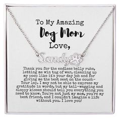 a necklace with the words to my amazing dog mom love written in silver on it