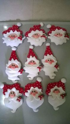 santa clause decorations are displayed on a table