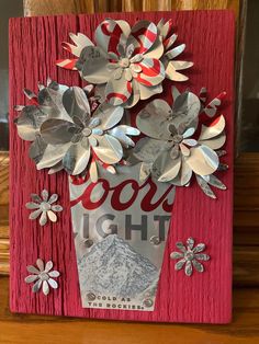 a red frame with silver flowers on it that says,'cool light'and snowflakes