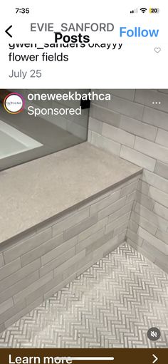 an image of a bathroom with tile on the walls and flooring in front of it