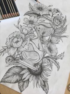 a pencil drawing of flowers and a vase with a bird in it on top of a piece of paper