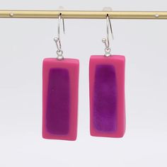 Add some fun to your outfit with these Pink Sloan Rectangular Earrings! The dangle style and lightweight design make them perfect for everyday wear. The pink bead with fuchsia accent adds a quirky touch, while the resin material guarantees durability. Get ready for compliments! Resin French hook ear wires 1.5" in length and are .75" in diameter Made in Philippines Style # LS24E20 Cheap Vibrant Pink Earrings, Long Dangle Earrings Hot Pink, Rectangular Earrings, Rectangle Earrings, Earrings Pink, Pink Beads, Resin Material, The Pink, Ear Wires