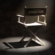 a director's chair sitting in the dark