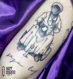 a black and white tattoo on the arm of a woman