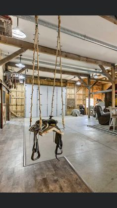 a room that has some kind of equipment hanging from it's ceiling and is empty