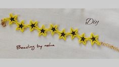 a yellow bracelet with black stars on it and the words beading by meen written in