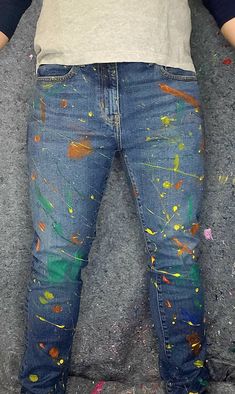 Each pair of jeans is hand painted for thay unique look. Default coloration is in photos: orange, yellow, and green. Use the personalization section or message us for different colors. We will be able to do most color requests and at no extra cost.  Looking for a baggy cut jeans? Ladies cut? Ripped blue jeans? Message us for a custom order  Machine Wash Cold, Tumble Dry Warm for best results Demin Jeans, Jeans Custom, Paint Splatter Jeans, Overalls Men, Palm Desert, Denim Jeans Men, Yellow Painting, Best Jeans, Paint Splatter