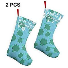 two christmas stockings with turtle designs hanging from the top, and one has merry christmas written on it