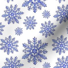 a white and blue snowflake pattern on fabric