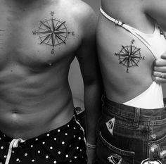 two men with compass tattoos on their backs