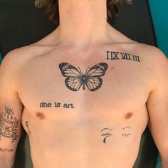 a man with a butterfly tattoo on his chest and the words, she is art