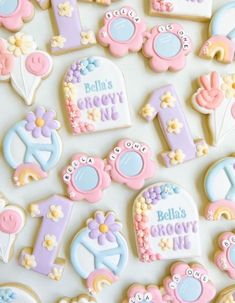 decorated cookies are arranged on a table for a baby's first birthday party or celebration