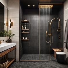 a walk in shower sitting next to a white sink and wooden shelfs on the wall