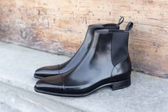 Unique Chelsea Boots Up For Grabs! After extreme popular demand, we brought some limited stock of these unique Carlos Santos Handgrade Chelsea Boots in Black Calf with Folded Stitching. Goodyear Welted in Portugal on the 387 Soft Square Last on a Handgrade Sole with Full Grain Black Calfskin Leather. Sizing Advice About the 387 Last: An chiseled last with a soft-squared toe and futuristic look. Perfect for lovers of the Adelaide and Italian shoes. Fits true to size and advice is to size down one Chelsea Boots Style, Italian Shoes, Beautiful Boots, Casual Suit, Goodyear Welt, For Lovers, Limited Stock, Fashion Boots, Chelsea Boots