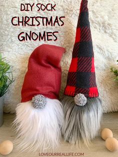 two gnome hats sitting next to each other on top of a wooden table with text overlay saying diy sock christmas gnomes