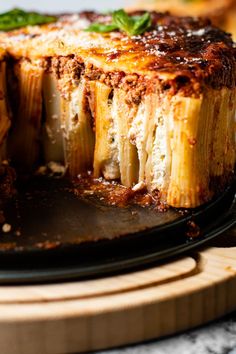 a close up of a plate of food with lasagna casserole on it