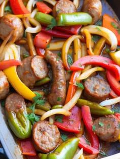 sausage and peppers stir fry in a pan