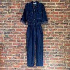 "Cute Vintage 80s Medium IDEAS Blue Denim jumpsuit overalls boiler suit snaps women's LABEL: IDEAS SIZE: Medium FABRIC: Denim/Cotton (fabric has no stretch) CONDITION: great vintage COLOR: Blue, dark hue Measurements: measured flat across-in inches  bust- 19\" waist-resting-12\" hips-20\" leg inseam-29\" arm inseam-16\"  shoulders across 19\" sleeve length- 18\" shoulder to crotch (from top of back of neck)-32\" overall length-60\" Jumpsuit has snap closures- all snaps work.   There are 2 chest Womens Overalls, Label Ideas, Jumpsuit Overalls, Boiler Suit, Vintage Color, Denim Cotton, Overalls Women, Denim Jumpsuit, Vintage Beauty