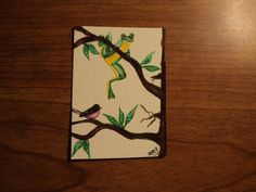 a painting of a frog on a tree branch