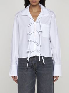 JW Anderson's white cotton cropped shirt featuring a pointed collar, self-tie bow on front, chest pocket, buttoned cuffs and Anchor logo embroidered on the back. ? Composition: 100% cotton Anchor Logo, Upcycle Shirt, Cropped Shirt, J W Anderson, Jw Anderson, Crop Shirt, Logo Embroidered, White Cotton, Bow Tie