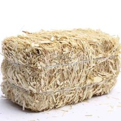 a bale of hay sitting on top of a white floor