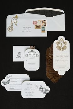 the wedding stationery is laid out and ready to be put into their guests'envelopes