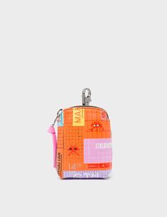 Florence Pouch Charm  - Lollipop Orange Leather Keychain Subway Stories Print - Front View Functional Pink Pouch Gift, Functional Pink Pouch For Gift, Trendy Travel Keychains With Key Clip, Rectangular Travel Coin Purse With Keychain, Trendy Rectangular Pouch With Interior Key Chain Holder, Trendy Bag Charm With Key Clip For Everyday Use, Functional Multicolor Bags For Gifts, Multicolor Rectangular Coin Purse With Interior Key Chain Holder, Multicolor Rectangular Coin Purse With Key Chain Holder