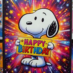 a happy birthday card with a cartoon dog holding a sign in front of fireworks and stars