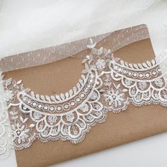 an image of a wedding card with lace on it