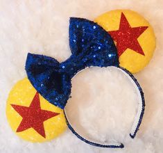 a mickey mouse ears with red, white and blue sequins