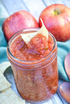 an apple salsa in a mason jar with tortilla chips