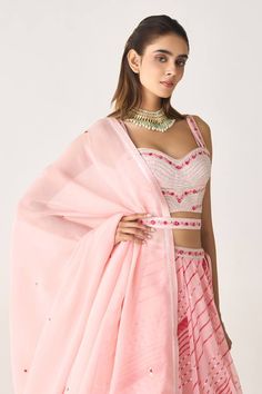 Blush pink attached cancan lehenga with leheriya print all over. Paired with thread, gota embroidered padded blouse in floral pattern. Comes with dupatta and belt. - Aza Fashions Pink Organza Choli With Gota Work, Festive Pink Palazzo Set With Unstitched Blouse, Navratri Pink Palazzo Set With Unstitched Blouse, Pink Pre-draped Saree With Gota Work For Navratri, Pink Organza Palazzo Set With Gota Work, Pink Sharara With Unstitched Blouse For Reception, Pink Palazzo Set With Unstitched Blouse For Festivals, Pink Georgette Sets With Traditional Drape, Pink Sharara With Unstitched Blouse And Traditional Drape